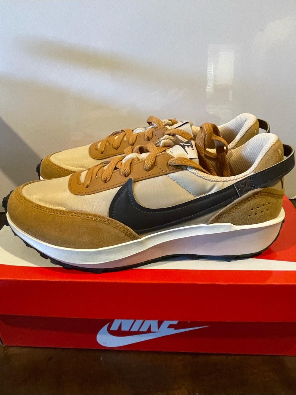 Nike Women’s Sneaker in Tan and Black. Brand new in box.